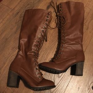 Tall lace up heeled boots